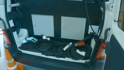 Roadside assistance car - comes to the electric car and charges its battery if the car runs out of charge the accumulator. Shot in motion