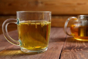 tea cup transparent lemongrass on a wooden table.