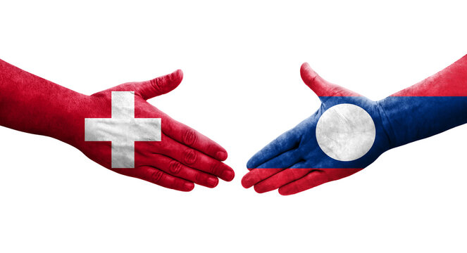 Handshake between Switzerland and Laos flags painted on hands, isolated transparent image.