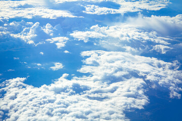 White clouds at blue air , view from the airplane window 