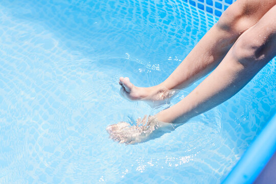 Someone's Feet In The Water While They Are Getting Ready To Jump Into The Pool For Their Next Swim