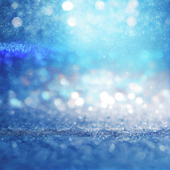 Christmas and winter holidays background with blue bokeh lights and snow.