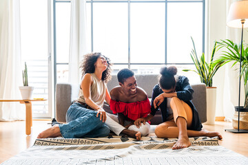 Three mixed race hispanic and black women bonding at home - Multiracial group of happy young female...