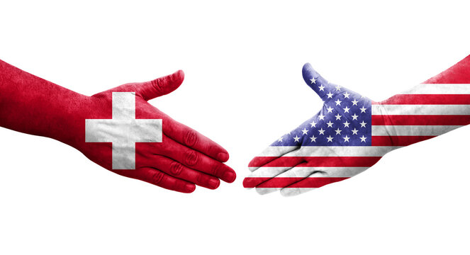 Handshake between Switzerland and USA flags painted on hands, isolated transparent image.