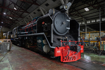 Obraz premium Steam locomotive train at the locomotive repair workshop