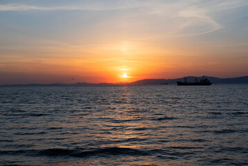 Obraz premium Beautiful orange sunset over the sea with soft selective focus. Beauty of nature concept