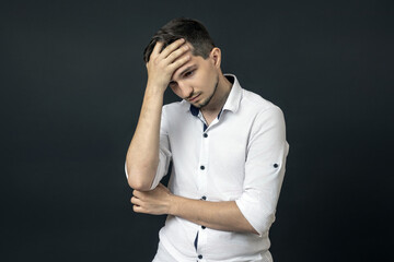 The man put his hand on his forehead. defeat concept.