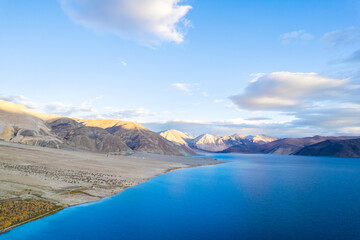 Fototapeta na wymiar Aerial landscape of Pangong Lake and mountains with clear blue sky, it's a highest saline water lake in Himalayas range, landmarks and popular for tourist attractions in Leh, Ladakh, India, Asia
