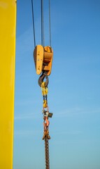 gantry crane with hook against blue sky