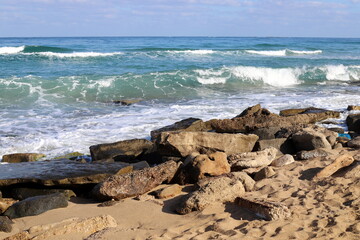 Fototapeta na wymiar The stones lie on the shores of the Mediterranean Sea.