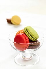 Macarons in a glass bowl.