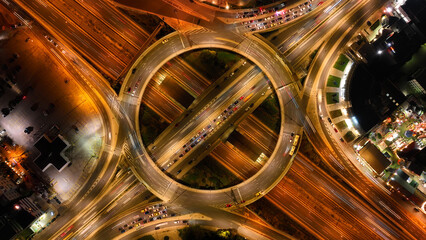Aerial drone night photo of illuminated urban elevated toll ring road junction and interchange overpass passing through Kifisias Avenue, Attica, Greece