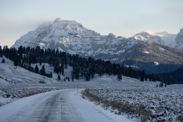 Iced-over road in a mountainous area in Yellowstone National Park