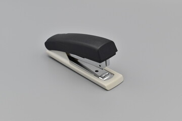 Stapler on a gray background