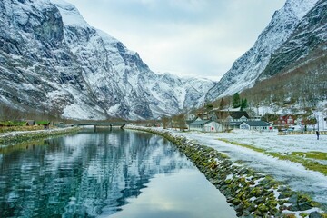 Mountains covered in snow reflected in a lake