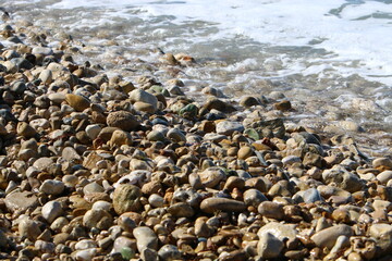 The stones lie on the shores of the Mediterranean Sea.