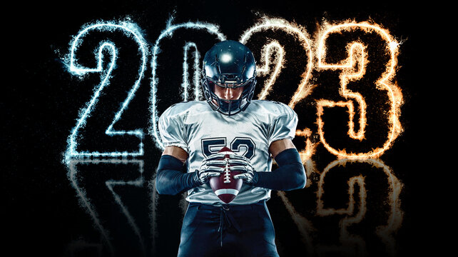 American football player black background with fire. Sports template for calendar design on 2023 year.