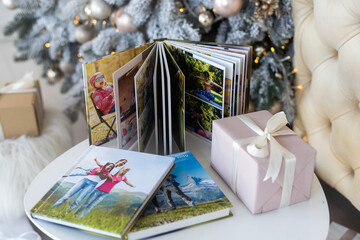 Naklejka na ściany i meble travel photo books lie near the Christmas tree