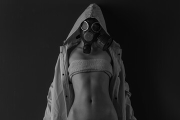 Naked woman in a protective gas mask