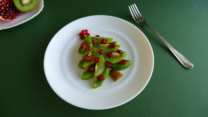 Funny edible Christmas and New Year tree idea for kids on green background