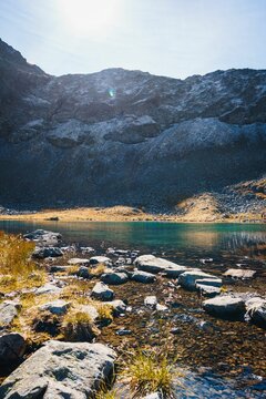 Vertical shot of a lake surrounded by the Hochjoch mountains in Schruns, Vorarlberg, Austria