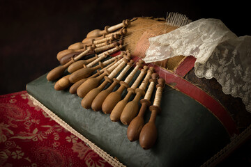 Real antique lace pillow with bobbins