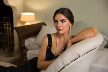 1920s Lady sitting on vintage sofa