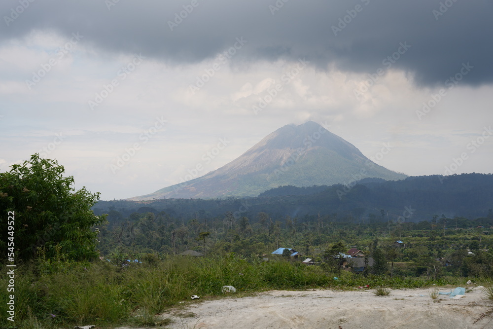 Wall mural Mount Sinabung (Indonesian: Gunung Sinabung, Karo: Deleng Sinabung) is a Pleistocene-to-Holocene stratovolcano of andesite and dacite in the Karo plateau of Karo Regency, North Sumatra, Indonesia.