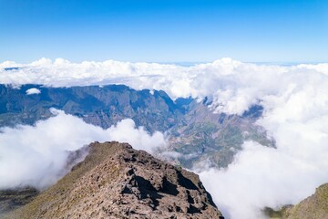 Beautiful shot of mountain peaks in the clouds