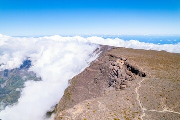 Beautiful shot of mountain peaks in the clouds