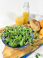 Microgreens with bagel and orange juice