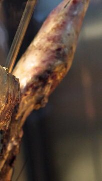 HD of smoking pork neck in smokehouse