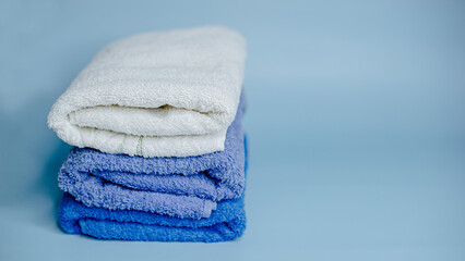 multicolored terry towels on a blue background
