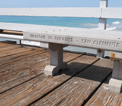 Welcome to Paradise written on a bench on the San Clemente Pier in Orange County, California, USA