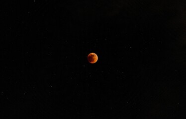 Beautiful view of a moon in the dark black sky at night