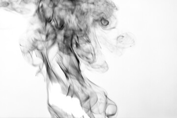 Thick black smoke on a white isolated background