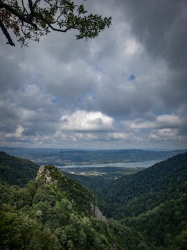 Vertical shot of a beautiful view on a mountain under cloudy sky