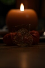 Vertical shot of candles with different shapes placed on a table