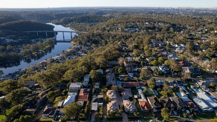 Woronora River surrounded by lush greenery and Woronora Bridge in Sutherland suburb South Sydney