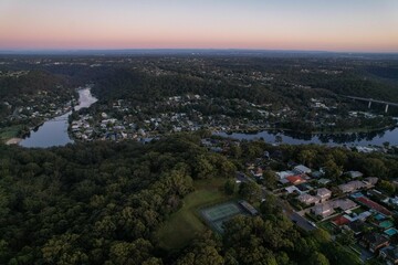 Woronora River surrounded by lush greenery and Woronora Bridge in Sutherland suburb South Sydney