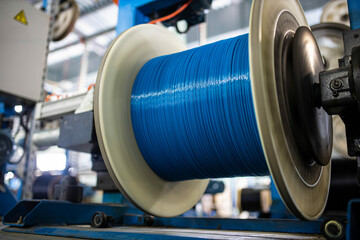 production of glass fiber fiber optic cable in the factory, Internet telecommunications wires in...