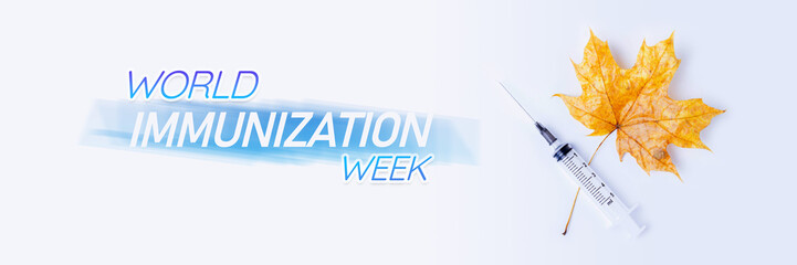 World Immunization Week. Autumn leaf and syringe on white background. Vaccination of population.