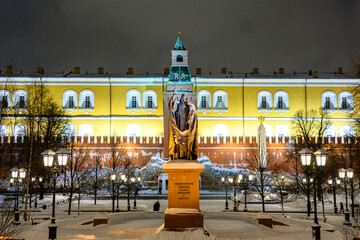 Fototapeta premium Spasskaya tower and winter Kremlin against the backdrop of street Christmas decorations.