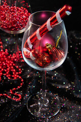 red christmas decorations, glass of red wine