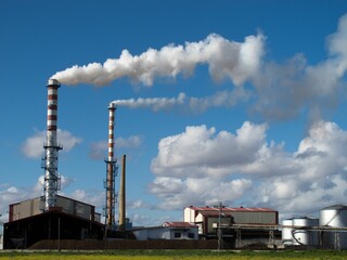 Industrial factories emitting toxic smoke, industrial waste into the environment, air pollution