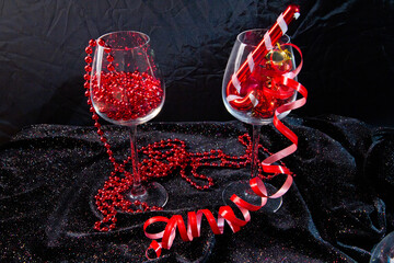 red christmas decorations, glass of red wine