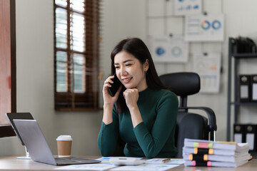 Beautiful asian businesswoman working in office. business finance concept
