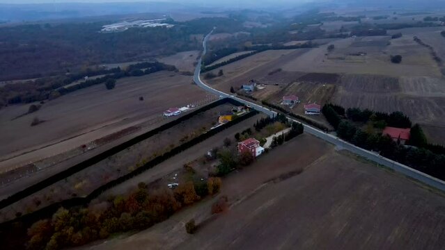 Aerial of the sunset over the fields and the highway in Silivri, Istanbul.