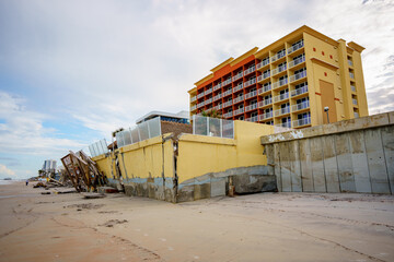 Beach buildings seawalls damaged by heavy surf from Hurricane Nicole Daytona Beach Florida