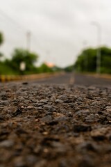 Vertical closeup shot of gravel rocks on a road